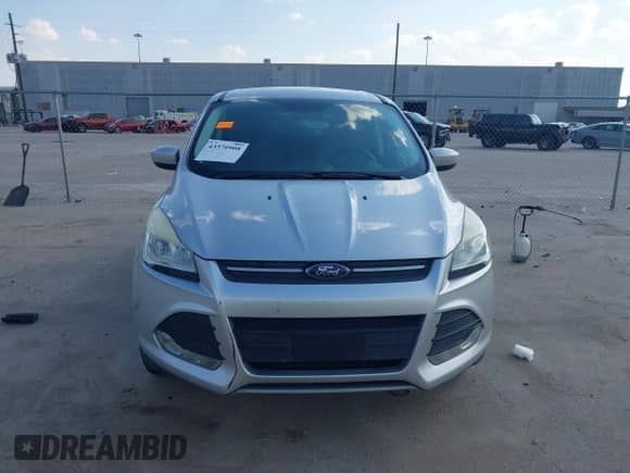 2014 Ford Escape SE z VIN 1FMCU0GX5EUA21457, wystawiony jako IAAI lot #43370908 z przebiegiem 143 709 mil mil oraz . Historia ofert i sprzedaży dostępna na DreamBid. Obrazek 12.