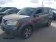 2014 Honda Pilot EX-L with VIN 5FNYF4H57EB001695, listed as a IAAI auction lot 43284018 with 150,075 mi miles and . Bid and sale history available at DreamBid. Image 2.