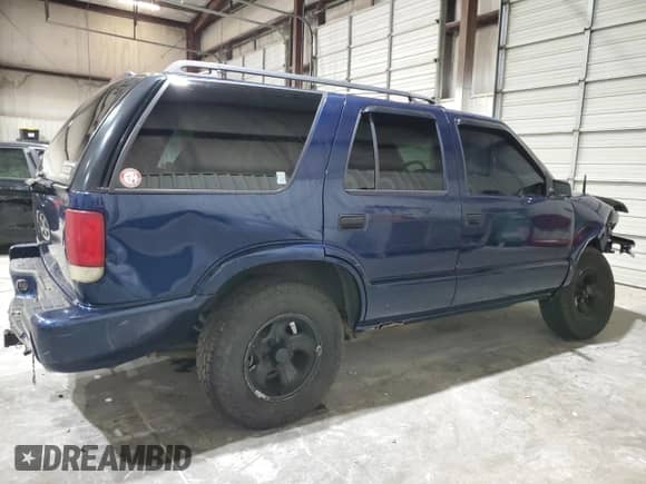 2000 Chevrolet Blazer LS z VIN 1GNCS13W7YK297644, wystawiony jako Copart lot #70089505 z przebiegiem 264 962 mil mil oraz Szkoda całkowita • Salvage title. Historia ofert i sprzedaży dostępna na DreamBid. Obrazek 3.