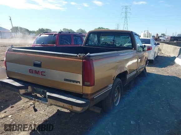 1989 GMC Sierra 1500 z VIN 1GTDC14K5KZ529078, wystawiony jako IAAI lot #43059983 z przebiegiem 158 207 mil mil oraz . Historia ofert i sprzedaży dostępna na DreamBid. Obrazek 4.