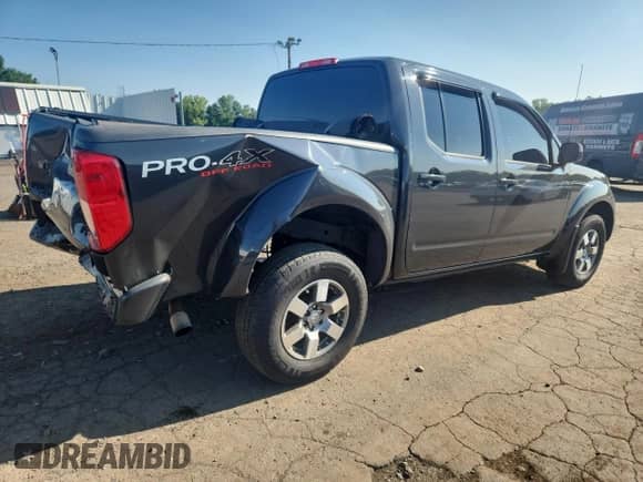 2010 Nissan Frontier Pro-4X z VIN 1N6AD0EV7AC437763, wystawiony jako Copart lot #66898325 z przebiegiem 134 351 mil mil oraz Szkoda całkowita • Salvage title. Historia ofert i sprzedaży dostępna na DreamBid. Obrazek 3.