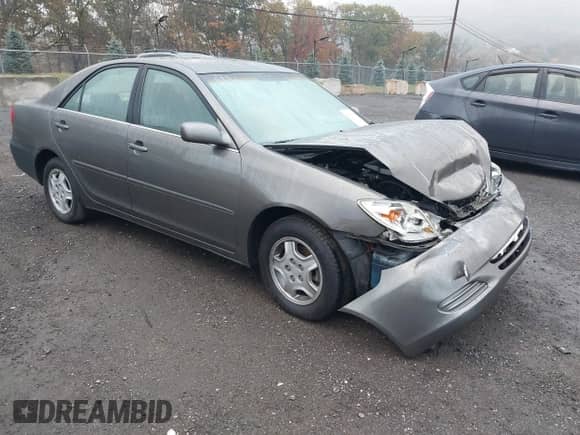 2003 Toyota Camry LE with VIN 4T1BF32K43U562869, listed as a IAAI auction lot 43506255 with 121,868 mi miles and . Bid and sale history available at DreamBid. Image 1.