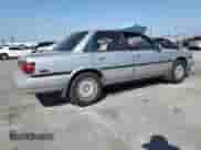 1990 Toyota Camry with VIN JT2VV22E3L3003353, listed as a Copart auction lot 68489125 with 131,662 mi miles and Clean title. Bid and sale history available at DreamBid. Image 3.