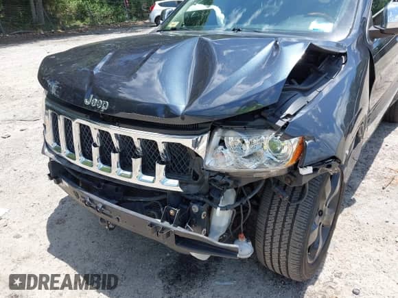 2012 Jeep Grand Cherokee Overland z VIN 1C4RJECT0CC209880, wystawiony jako IAAI lot #42533003 z przebiegiem 89 980 mil mil oraz . Historia ofert i sprzedaży dostępna na DreamBid. Obrazek 6.