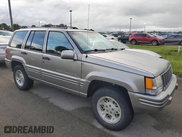 1998 Jeep Grand Cherokee Limited z VIN 1J4GZ78S2WC222768, wystawiony jako Copart lot #73942154 z przebiegiem Nie podano mil oraz Szkoda całkowita • Salvage title. Historia ofert i sprzedaży dostępna na DreamBid. Obrazek 4.
