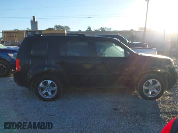 2015 Honda Pilot EX-L with VIN 5FNYF4H56FB052123, listed as a IAAI auction lot 43427901 with 197,741 mi miles and . Bid and sale history available at DreamBid. Image 14.