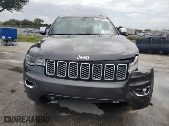 2017 Jeep Grand Cherokee Overland with VIN 1C4RJECG5HC605538, listed as a Copart auction lot 81946415 with 100,658 mi miles and Salvage title. Bid and sale history available at DreamBid. Image 5.