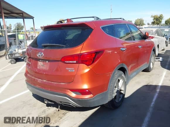 2017 Hyundai Santa Fe 2.4L z VIN 5XYZTDLB1HG443833, wystawiony jako IAAI lot #42908168 z przebiegiem 137 312 mil mil oraz . Historia ofert i sprzedaży dostępna na DreamBid. Obrazek 4.