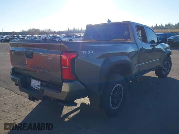 2024 Toyota Tacoma SR5 with VIN 3TMLB5JN6RM048448, listed as a IAAI auction lot 41005722 with 1,562 mi miles and . Bid and sale history available at DreamBid. Image 4.