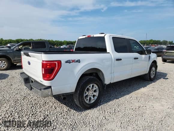 2023 Ford F-150 Lariat with VIN 1FTFW1E89PFA91516, listed as a Copart auction lot 61666315 with 65,711 mi miles and Salvage title. Bid and sale history available at DreamBid. Image 3.