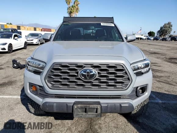 2021 Toyota Tacoma SR z VIN 3TYCZ5AN3MT024049, wystawiony jako Copart lot #84284885 z przebiegiem 75 927 mil mil oraz Szkoda całkowita • Salvage title. Historia ofert i sprzedaży dostępna na DreamBid. Obrazek 5.