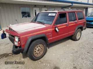 1991 Jeep Grand Cherokee with VIN 1J4FJ88S8ML629144, listed as a Copart auction lot 71988814 with 185,129 mi miles and Salvage title. Bid and sale history available at DreamBid. Image 1.