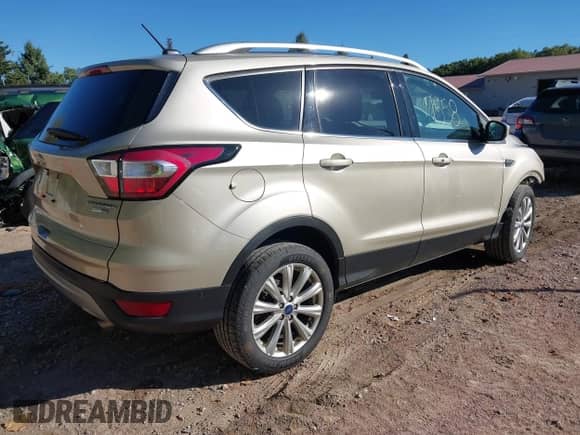 2017 Ford Escape Titanium with VIN 1FMCU9J95HUD42000, listed as a IAAI auction lot 43387558 with 122,185 mi miles and . Bid and sale history available at DreamBid. Image 4.