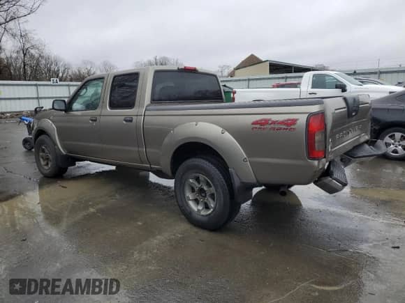 2004 Nissan Frontier XE with VIN 1N6ED29YX4C409431, listed as a Copart auction lot 45340255 with 210,685 mi miles and Salvage title. Bid and sale history available at DreamBid. Image 2.