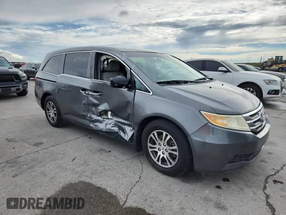2012 Honda Odyssey EX with VIN 5FNRL5H47CB060642, listed as a Copart auction lot 82143945 with 75,909 mi miles and Salvage title. Bid and sale history available at DreamBid. Image 4.