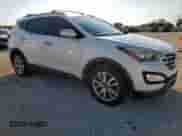 2015 Hyundai Santa Fe с VIN 5XYZU3LAXFG266131, выставлен на аукционе Copart как лот 70878385 с пробегом 98 363 миль миль и Списание • Salvage title. История ставок и продаж доступна на DreamBid. Изображение 4.