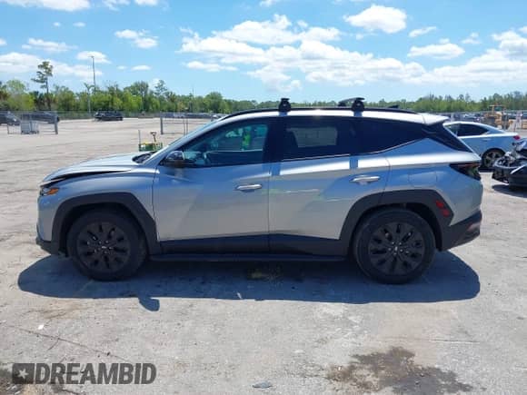 2023 Hyundai Tucson XRT with VIN KM8JFCAEXPU261133, listed as a IAAI auction lot 42270010 with 34,709 mi miles and . Bid and sale history available at DreamBid. Image 14.