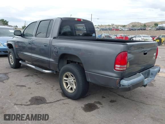 2003 Dodge Dakota Sport with VIN 1D7HG38N53S273174, listed as a IAAI auction lot 42872040 with 148,408 mi miles and . Bid and sale history available at DreamBid. Image 3.