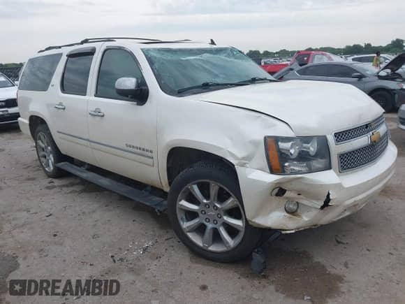 2013 Chevrolet Suburban LTZ z VIN 1GNSCKE00DR209381, wystawiony jako IAAI lot #42469271 z przebiegiem Nie podano mil oraz . Historia ofert i sprzedaży dostępna na DreamBid. Obrazek 1.