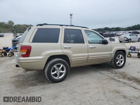 2001 Jeep Grand Cherokee Limited с VIN 1J4GX58N11C737807, выставлен на аукционе Copart как лот 82353575 с пробегом 156 723 миль миль и Списание • Salvage title. История ставок и продаж доступна на DreamBid. Изображение 3.
