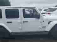 2022 Jeep Wrangler Unlimited Sahara Altitude with VIN 1C4HJXEG9NW232468, listed as a IAAI auction lot 42667697 with 40,881 mi miles and . Bid and sale history available at DreamBid. Image 14.