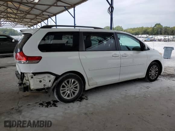 2012 Toyota Sienna XLE with VIN 5TDYK3DC8CS205280, listed as a Copart auction lot 81258065 with 185,820 mi miles and Salvage title. Bid and sale history available at DreamBid. Image 3.