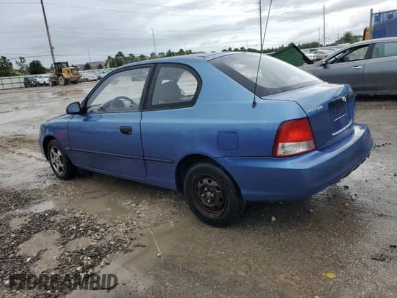 2001 Hyundai Accent z VIN KMHCF35G11U112976, wystawiony jako Copart lot #68692384 z przebiegiem 152 797 mil mil oraz Szkoda całkowita • Salvage title. Historia ofert i sprzedaży dostępna na DreamBid. Obrazek 2.