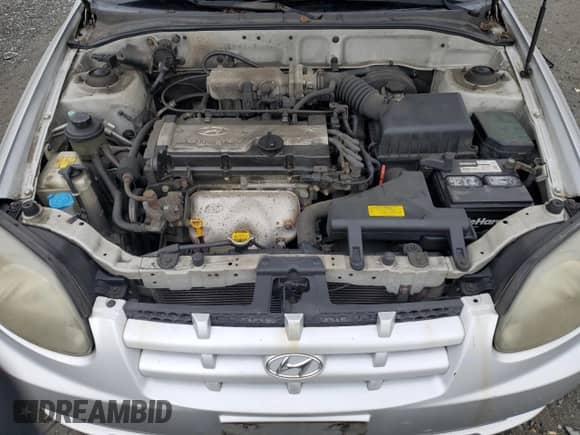 2005 Hyundai Accent GLS z VIN KMHCG45C25U636868, wystawiony jako Copart lot #82320125 z przebiegiem 136 913 mil mil oraz Szkoda całkowita • Salvage title. Historia ofert i sprzedaży dostępna na DreamBid. Obrazek 11.