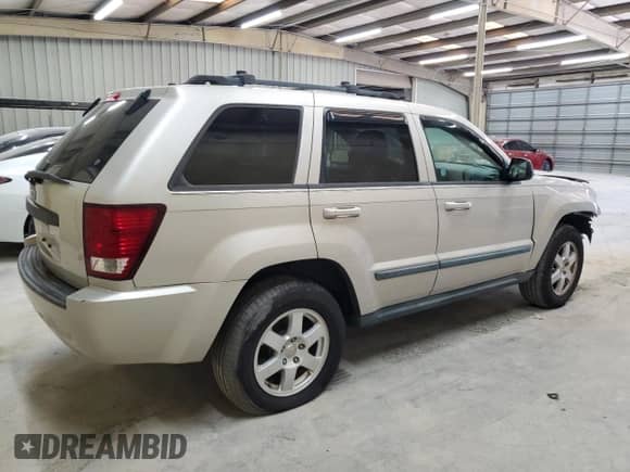 2009 Jeep Grand Cherokee Laredo with VIN 1J8GS48K19C507693, listed as a Copart auction lot 62155915 with 193,382 mi miles and Salvage title. Bid and sale history available at DreamBid. Image 3.