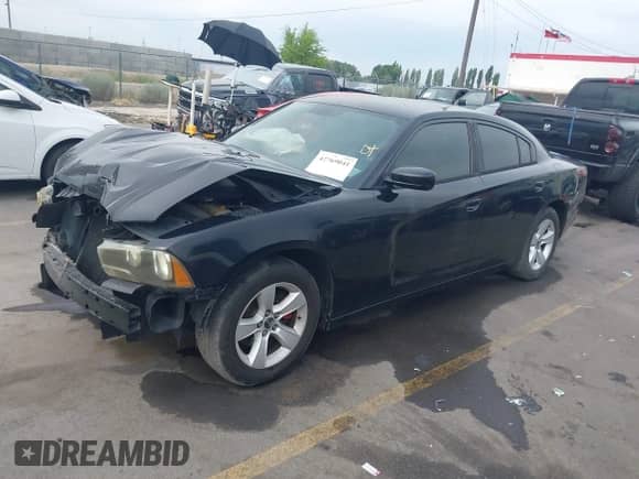 2012 Dodge Charger SE with VIN 2C3CDXBG2CH137983, listed as a IAAI auction lot 42769041 with 128,239 mi miles and . Bid and sale history available at DreamBid. Image 2.