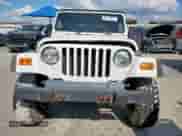 2001 Jeep Wrangler Sport с VIN 1J4FA49S01P305620, выставлен на аукционе Copart как лот 85516025 с пробегом Не указан миль и Списание • Salvage title. История ставок и продаж доступна на DreamBid. Изображение 5.