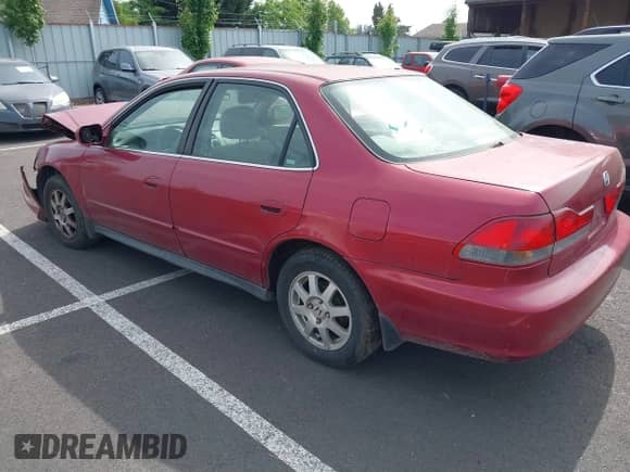 2002 Honda Accord SE with VIN 1HGCG56702A085916, listed as a IAAI auction lot 42466557 with 203,744 mi miles and . Bid and sale history available at DreamBid. Image 3.