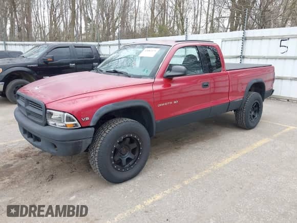 1999 Dodge Dakota SLT with VIN 1B7GG22Y1XS260429, listed as a IAAI auction lot 42082171 with 214,037 mi miles and . Bid and sale history available at DreamBid. Image 2.