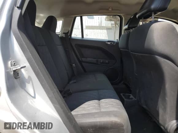 2009 Dodge Caliber SE with VIN 1B3HB28A59D161361, listed as a Copart auction lot 64144715 with 173,288 mi miles and Clean title. Bid and sale history available at DreamBid. Image 10.