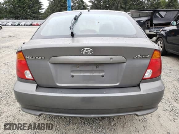 2004 Hyundai Accent GL с VIN KMHCG35C44U299645, выставлен на аукционе Copart как лот 63728174 с пробегом 159 604 миль миль и Чистый • Clean title. История ставок и продаж доступна на DreamBid. Изображение 6.