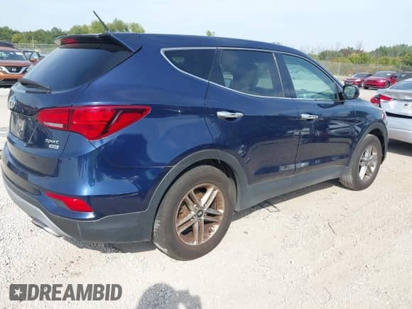 2018 Hyundai Santa Fe 2.4L z VIN 5XYZTDLB7JG562119, wystawiony jako IAAI lot #43221548 z przebiegiem 244 228 mil mil oraz . Historia ofert i sprzedaży dostępna na DreamBid. Obrazek 4.