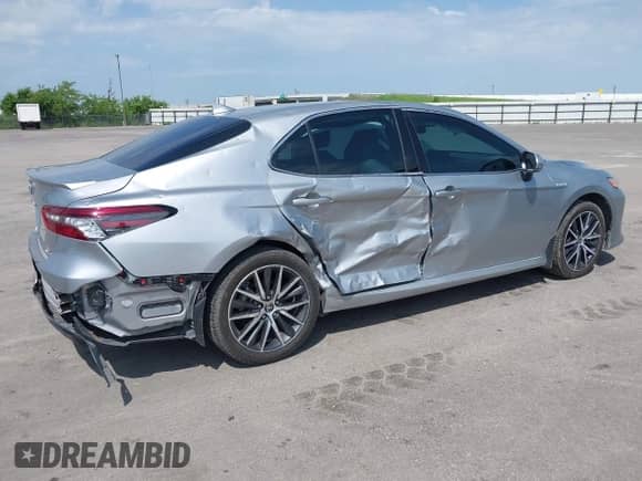 2021 Toyota Camry Hybrid XLE with VIN 4T1F31AK5MU565376, listed as a IAAI auction lot 42687616 with 57,880 mi miles and . Bid and sale history available at DreamBid. Image 6.