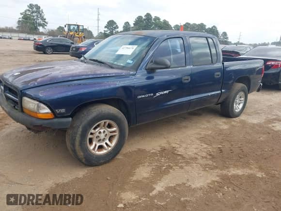 2001 Dodge Dakota Sport with VIN 1B7HL2AX61S265190, listed as a IAAI auction lot 41796670 with 244,645 mi miles and . Bid and sale history available at DreamBid. Image 2.
