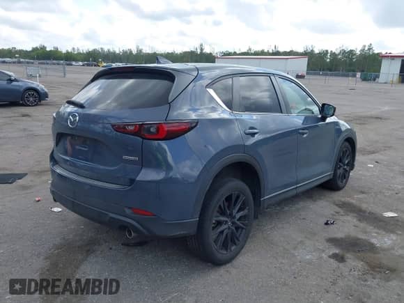 2022 Mazda CX-5 S Carbon Edition z VIN JM3KFBCM3N0551653, wystawiony jako IAAI lot #41495011 z przebiegiem 49 842 mil mil oraz . Historia ofert i sprzedaży dostępna na DreamBid. Obrazek 4.