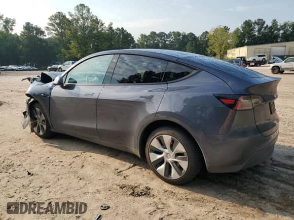 2023 Tesla Model Y Long Range with VIN 7SAYGAEE4PF668889, listed as a Copart auction lot 67239314 with 26,874 mi miles and Salvage title. Bid and sale history available at DreamBid. Image 2.