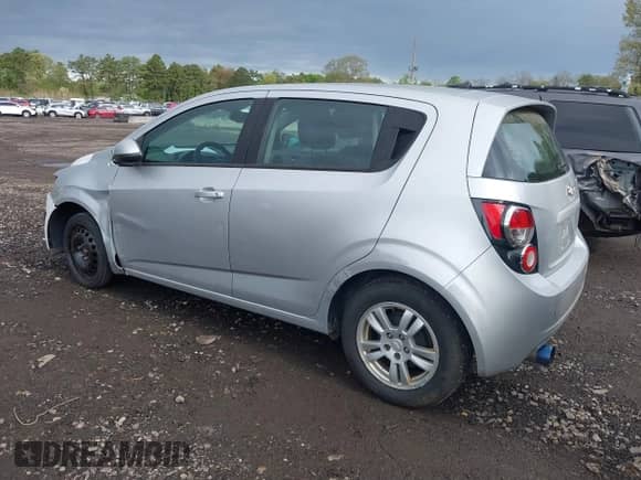 2012 Chevrolet Sonic LS with VIN 1G1JB6SH4C4198334, listed as a IAAI auction lot 42200028 with 207,498 mi miles and . Bid and sale history available at DreamBid. Image 3.
