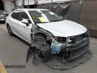 2021 Toyota Camry Hybrid XLE with VIN 4T1F31AK0MU569352, listed as a IAAI auction lot 42269290 with 80,617 mi miles and . Bid and sale history available at DreamBid. Image 1.