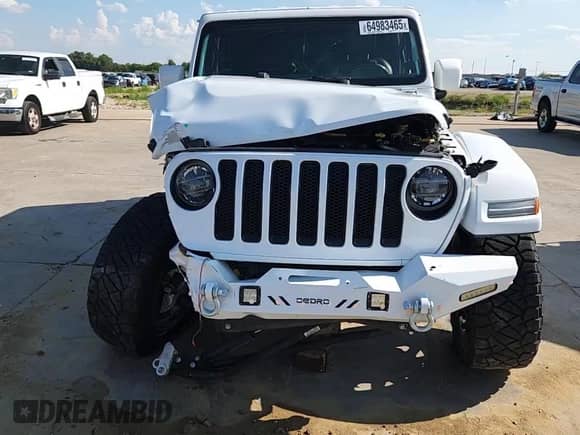 2021 Jeep Wrangler Unlimited Sahara High Altitude with VIN 1C4HJXENXMW509657, listed as a Copart auction lot 64983465 with 87,621 mi miles and Salvage title. Bid and sale history available at DreamBid. Image 14.