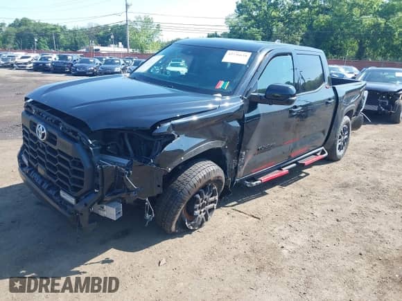 2022 Toyota Tundra SR5 with VIN 5TFLA5DB9NX009104, listed as a IAAI auction lot 42536638 with 77,485 mi miles and . Bid and sale history available at DreamBid. Image 2.
