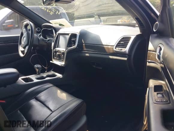 2015 Jeep Grand Cherokee Overland with VIN 1C4RJECG5FC119129, listed as a IAAI auction lot 42568400 with 177,312 mi miles and . Bid and sale history available at DreamBid. Image 5.