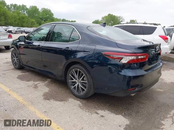 2021 Toyota Camry Hybrid XLE with VIN 4T1F31AK8MU563752, listed as a IAAI auction lot 42134620 with 19,484 mi miles and . Bid and sale history available at DreamBid. Image 3.