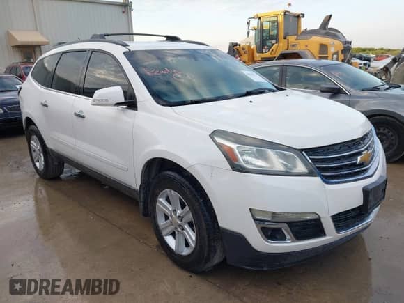 2014 Chevrolet Traverse LT z VIN 1GNKRHKD0EJ293923, wystawiony jako IAAI lot #42900872 z przebiegiem 179 018 mil mil oraz . Historia ofert i sprzedaży dostępna na DreamBid. Obrazek 1.