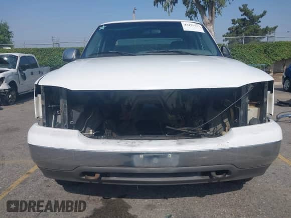 2000 GMC Sierra 1500 SLE z VIN 1GTEC19T0YZ300810, wystawiony jako IAAI lot #42471227 z przebiegiem Nie podano mil oraz . Historia ofert i sprzedaży dostępna na DreamBid. Obrazek 6.
