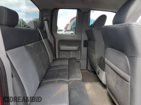 2007 Ford F-150 XLT z VIN 1FTPX14577FB42066, wystawiony jako Copart lot #69980405 z przebiegiem 83 738 mil mil oraz Czysty tytuł • Clean title. Historia ofert i sprzedaży dostępna na DreamBid. Obrazek 10.