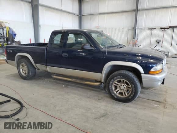 2003 Dodge Dakota SLT z VIN 1D7HG42N13S111122, wystawiony jako Copart lot #65447505 z przebiegiem 89 870 mil mil oraz Szkoda całkowita • Salvage title. Historia ofert i sprzedaży dostępna na DreamBid. Obrazek 4.